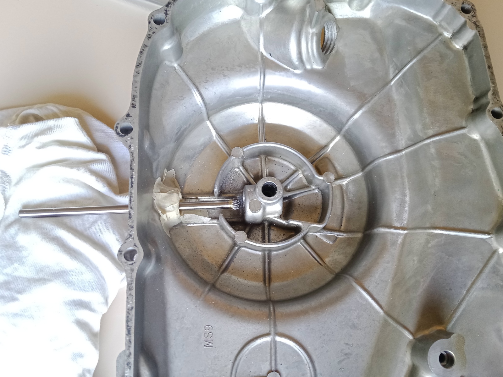 Removing a roller bearing from a clutch crankcase using a carbide burr