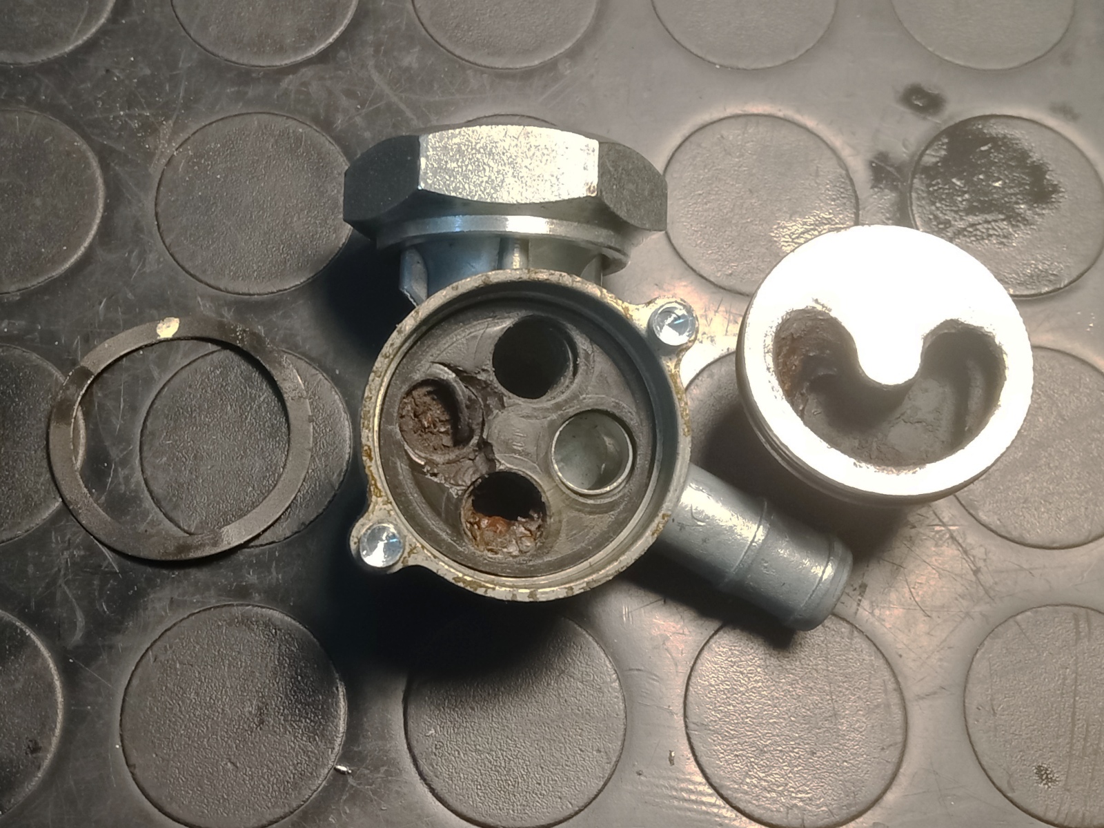 Debris inside and damaged gasket